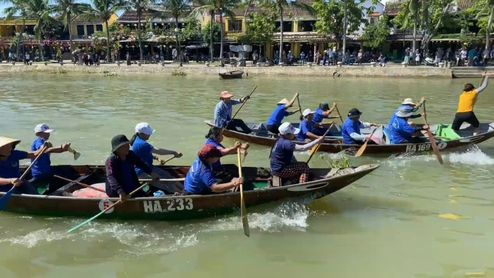 a group of people rowing a boat