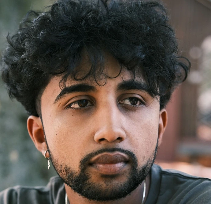 A close up of a person wearing a necklace