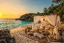 Boho beach picnic at sunset.webp