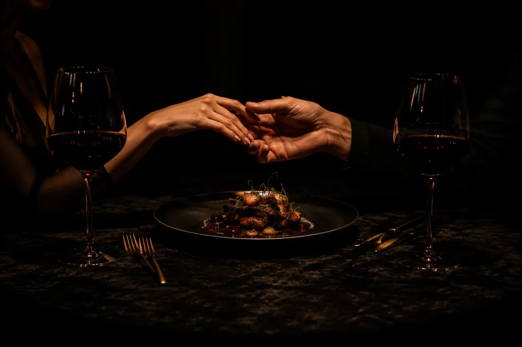 Romantic fine dining under dim lights.webp