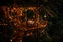 Cozy treetop dinner under the stars.webp